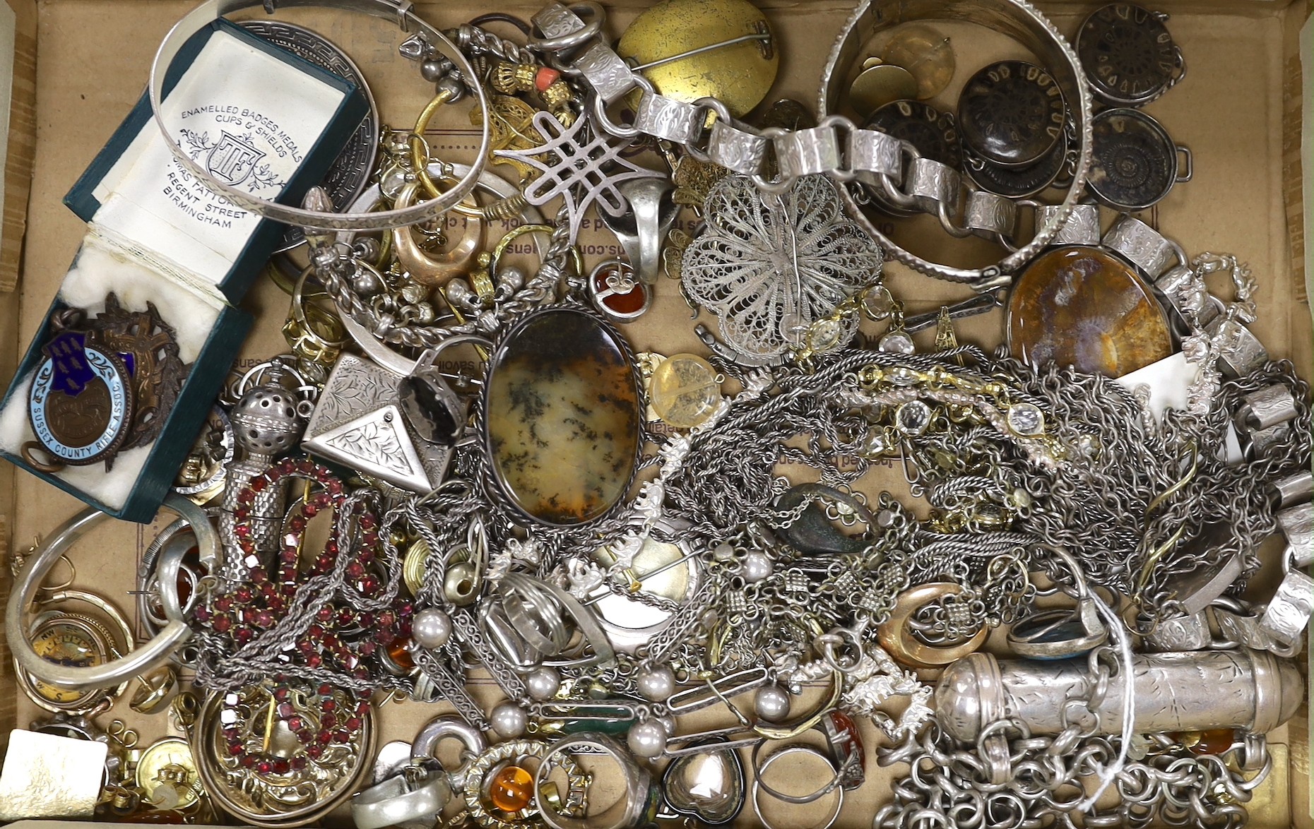 A collection of assorted 19th century and later jewellery, including Middle Eastern white metal canister in chain, yellow metal eat studs and other items including rings, toothpick, necklaces, silver stamp case etc.